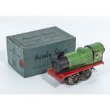 A clock work Hornby clockwork train in box. Working