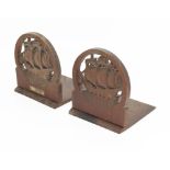 A pair of Arts and Craft Bookends with carved ships, with plaque attached From the teak of H.M.S