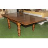 A large Victorian oak draw leaf table to seat 8/10.