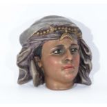 Terracotta bust of an Arabian girl in headdress