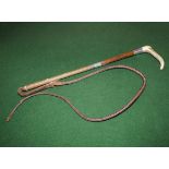 A horn handled riding whip