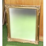 A gilt framed wall mirror