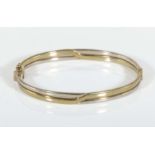 An 9ct yellow gold bangle