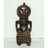 A hand carved West African fetish figure mid 20th century