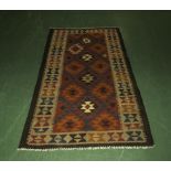 A Chobi vegetable dyed rug 107 cm x 191 cm