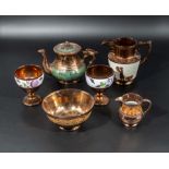A collection of copper lustre ware.