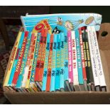 A box containing Dandy and Beano annuals