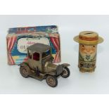 A boxed Shucko tin plate ford car together with a tin toy money bank in the form of a man in a