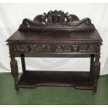 A carved oak hall table