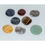 A collection of 8 named semi-precious palm stones