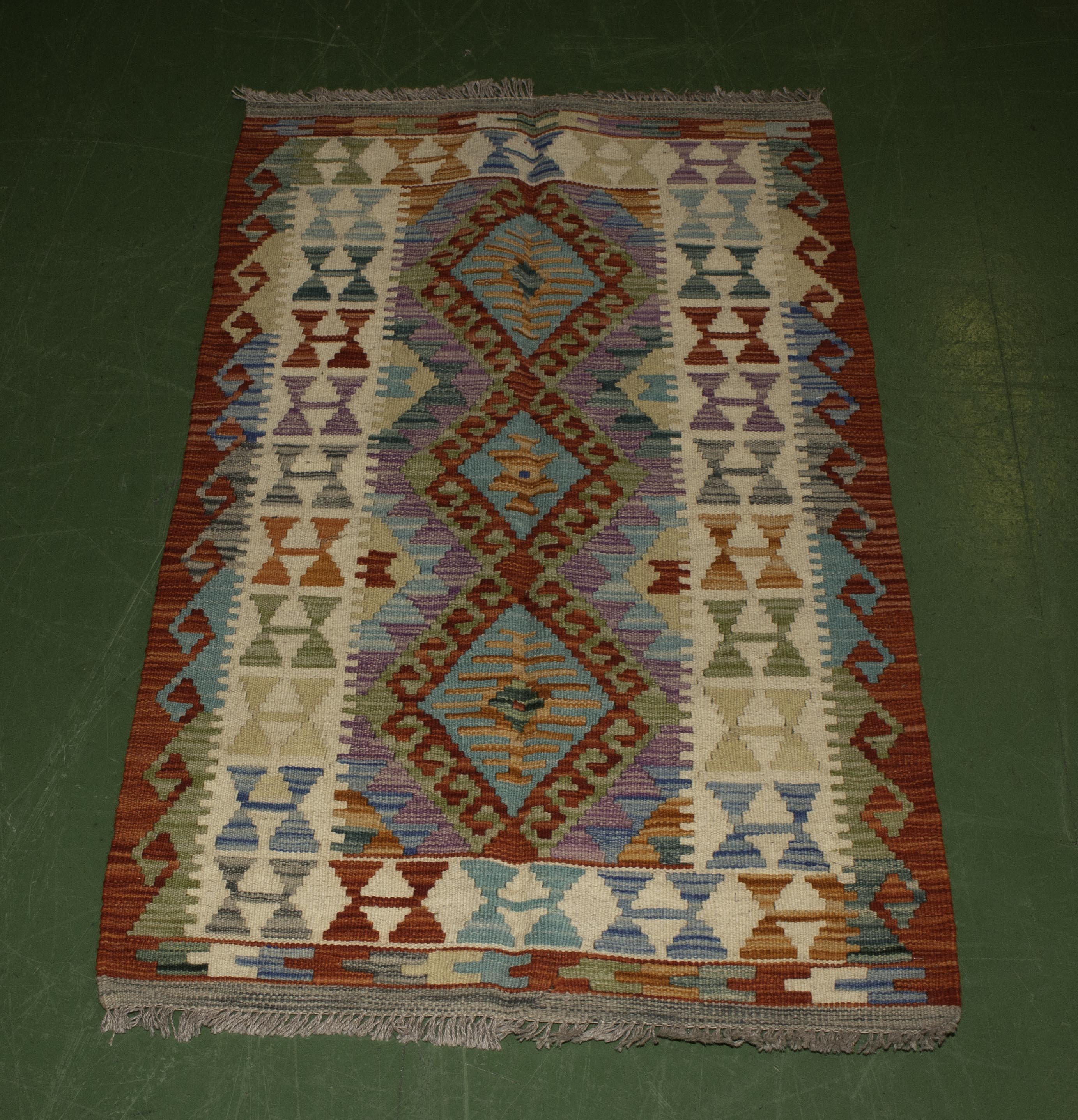 A Chobi vegetable dyed rug 128cm x 77cm