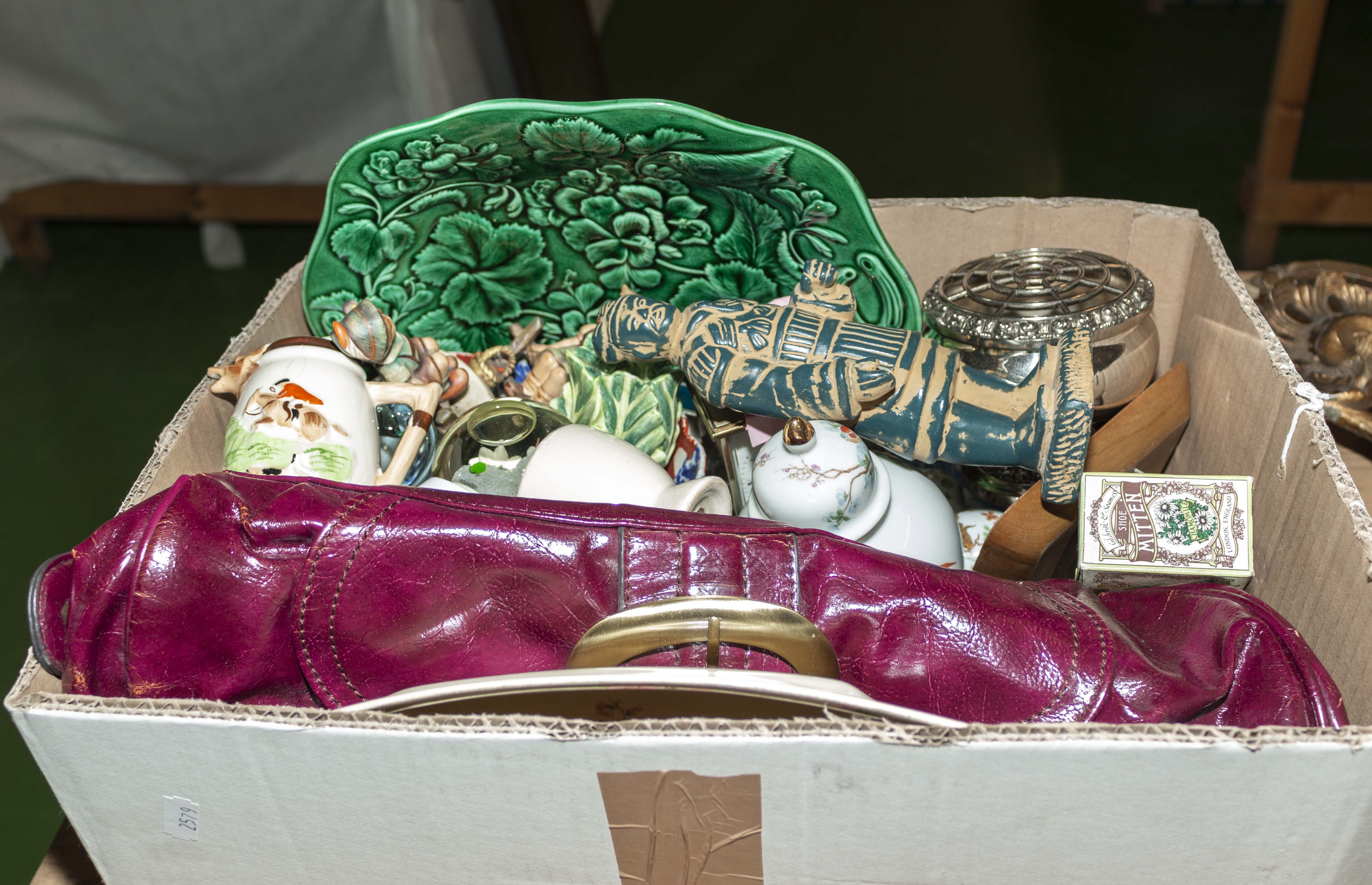 A box containing pottery items and others