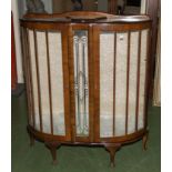 A vintage walnut display cabinet.