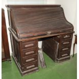 A mahogany roll top desk.