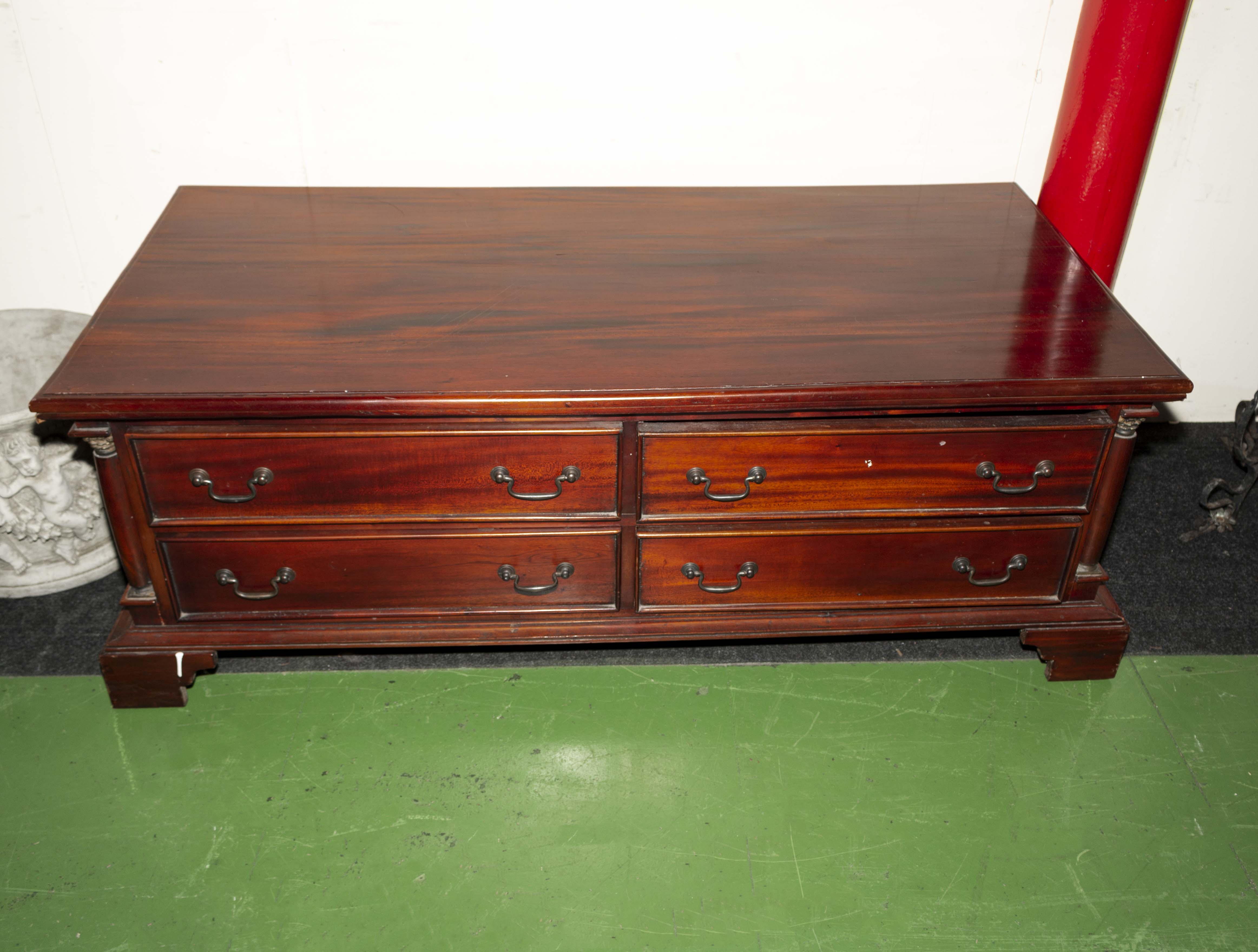A large coffee table with drawers