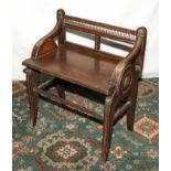 A James Shoolbred and company oak and brass mounted window seat. Lozenger date stamp to seat Trade