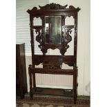 A carved oak hall stand.