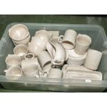 A box containing a pottery part dinner/tea service