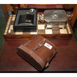 A chess set, hip flask, binoculars and a butter dish