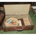 A vintage suitcase, photograph and plaque