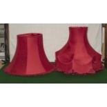 Two large red lamp shades