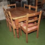 A pine kitchen table and six chairs