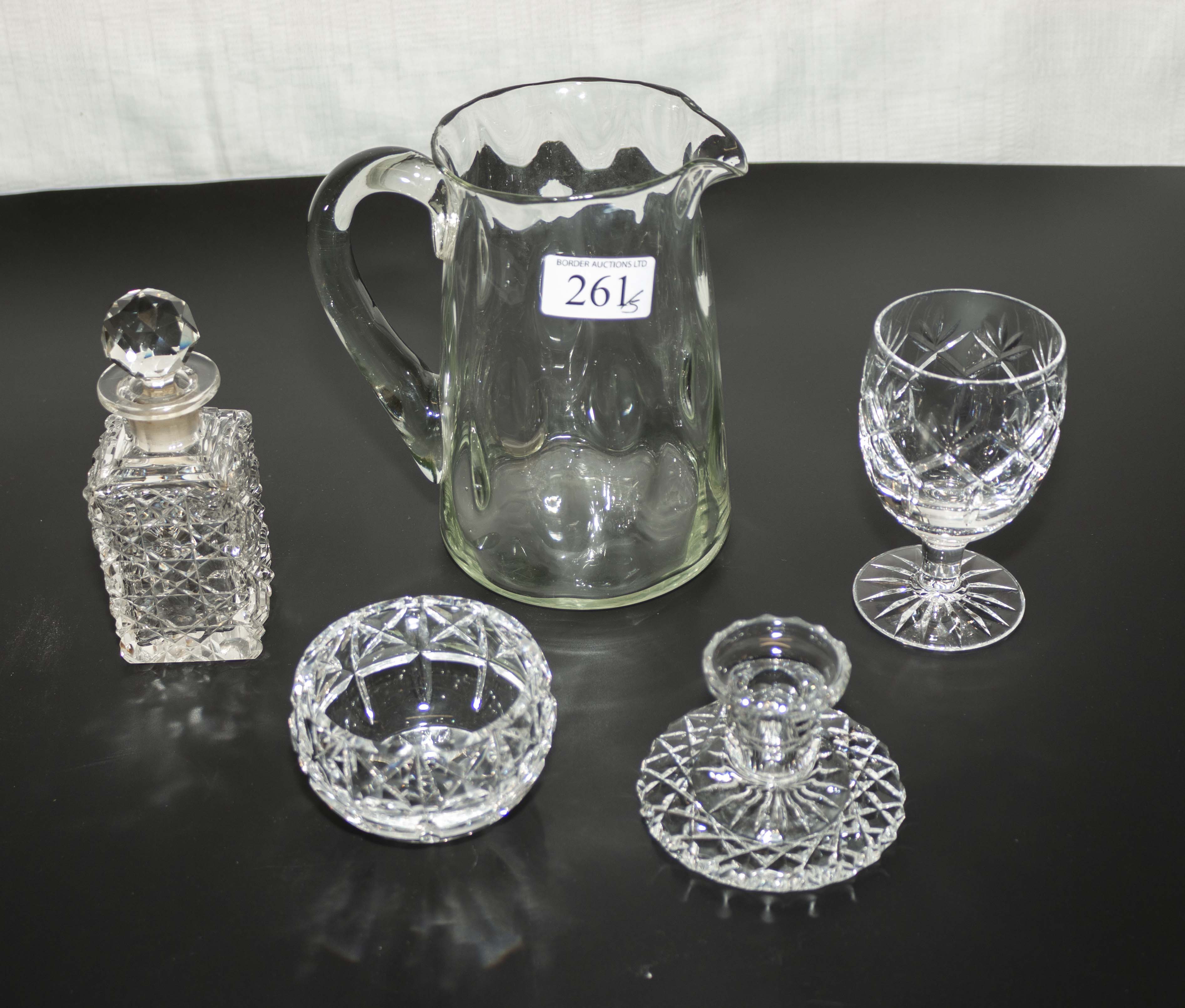 A cut glass perfume bottle, candlestick, bowl and two other items