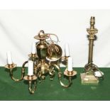 A five branch brass ceiling light fitting and a lamp base