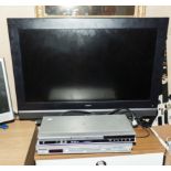 A Goodman television and two DVD players