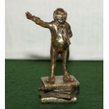 A small brass figure of Charles Dickens