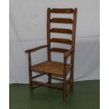 A ladder back arm chair