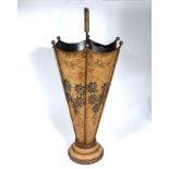 A decorated metal umbrella stand