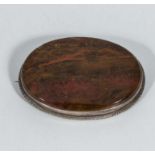 A silver brooch set with a Scottish agate stone