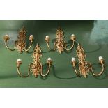 Four brass wall sconces