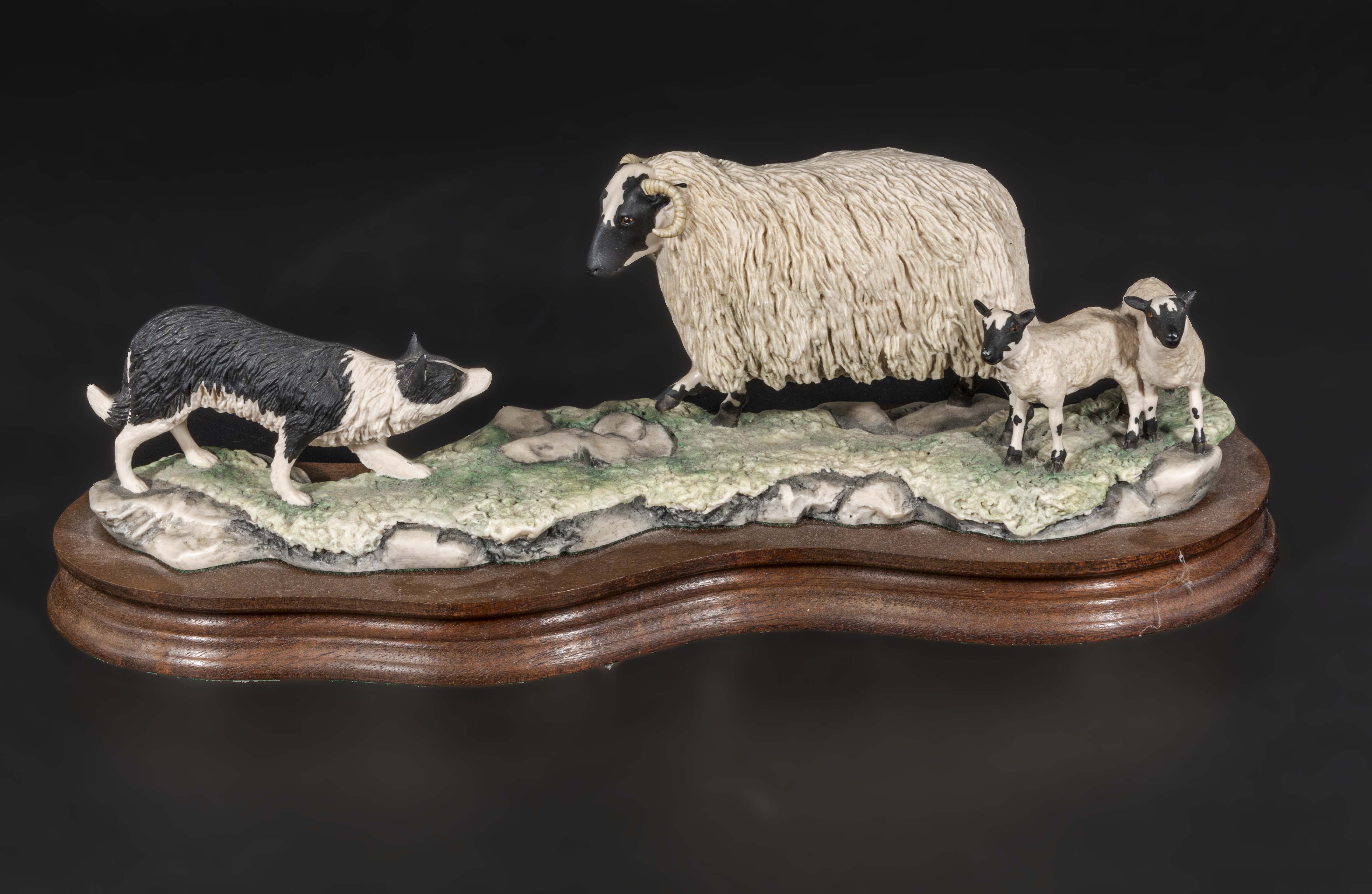 A Border Fine Arts figure of sheep dog ewe and lambs. 12 inches long