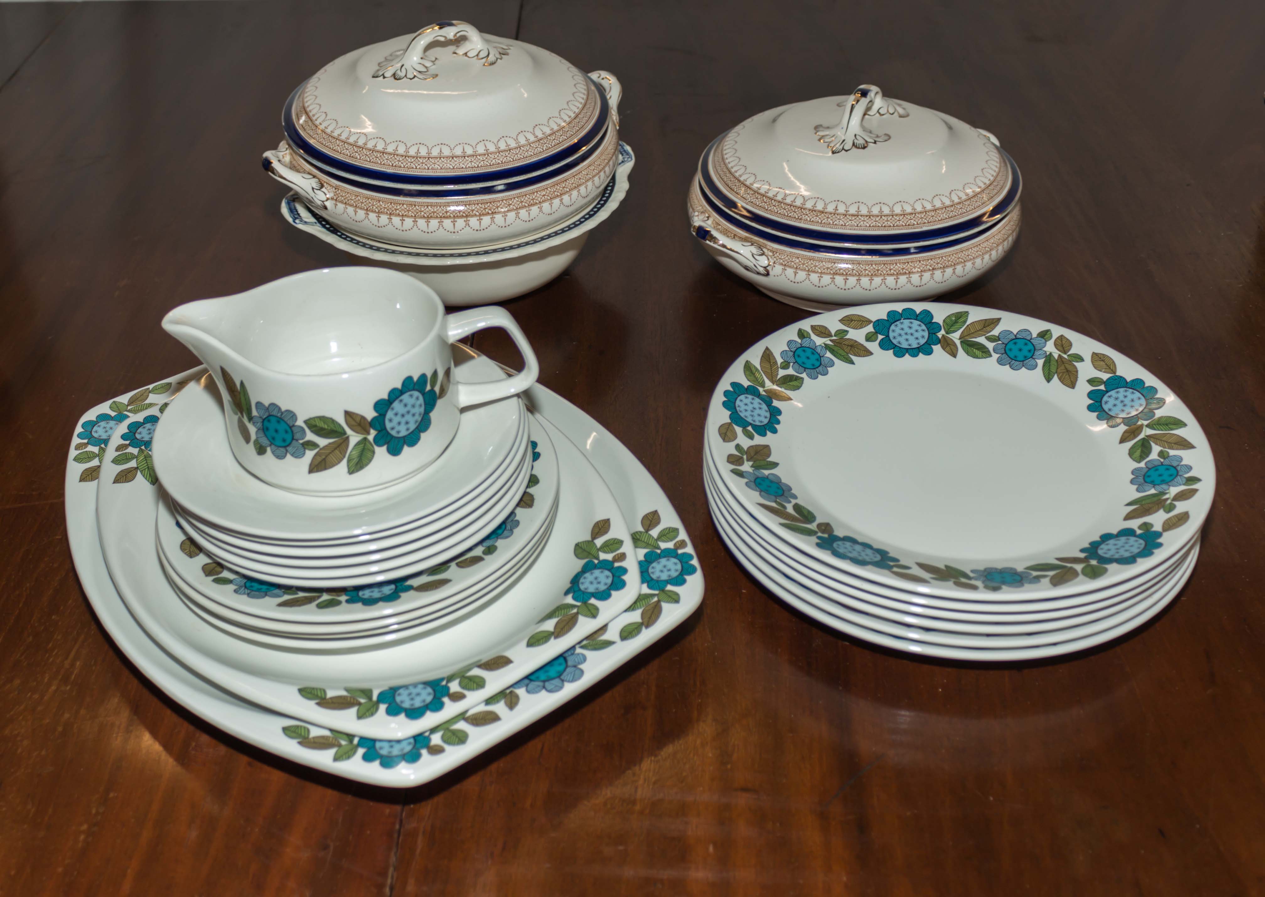 A part vintage dinner service and three tureens