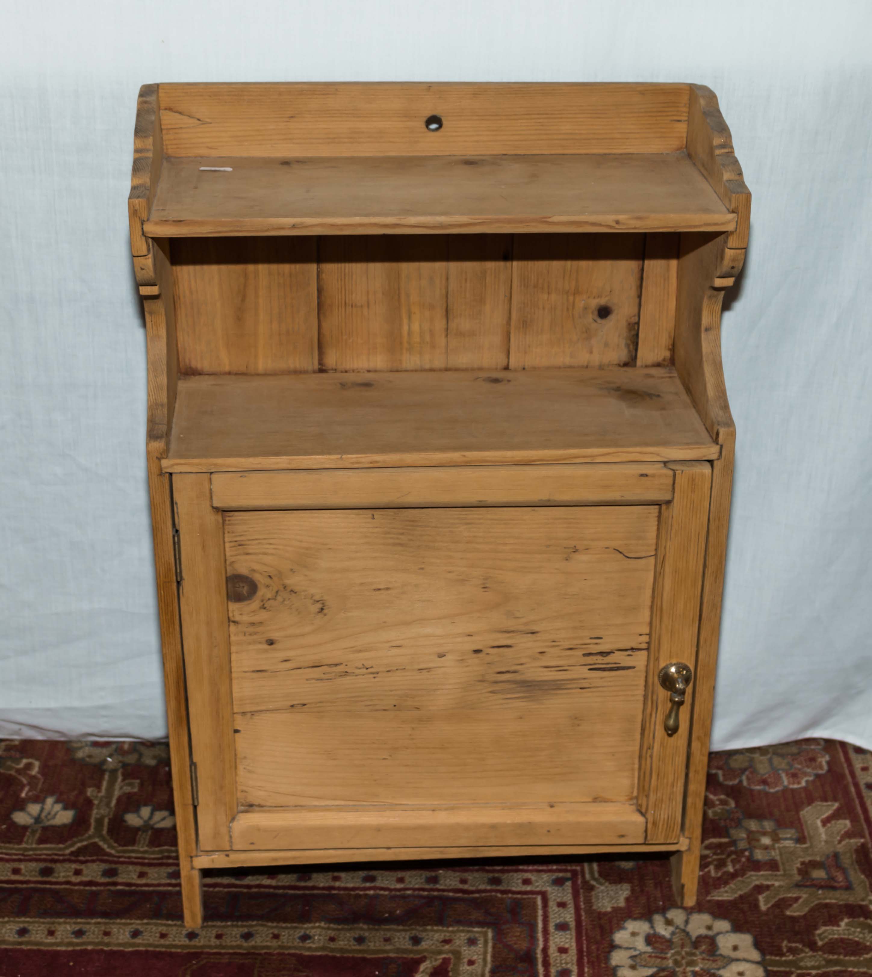 A small oak wall cabinet