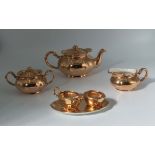 A gold glazed pottery part tea set