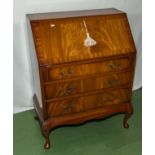 A vintage mahogany bureau