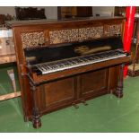 A Broadwood upright rosewood piano with fretted front