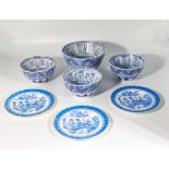 Four blue and white pottery bowls together with three plates
