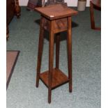 A mahogany plant stand