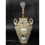 A reticulated lamp with floral decoration 30cm tall