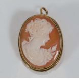 A small gold framed cameo