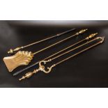 A set of brass fire irons