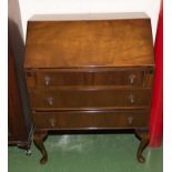 A 1940's mahogany bureau