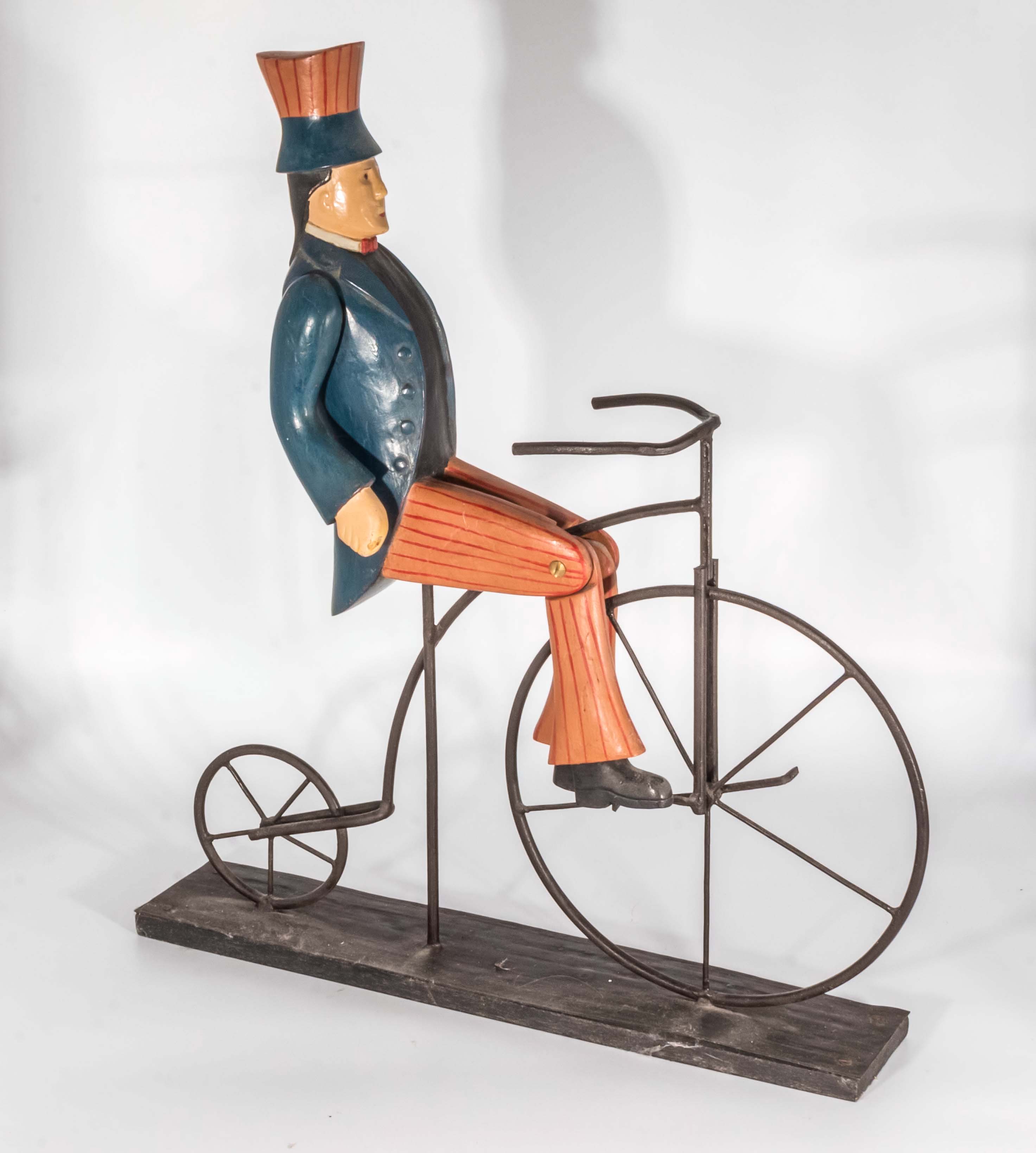 A model of a gentleman riding a penny farthing