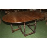 A late Victorian oak gate legged table