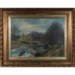 A gilt framed oil on canvas depicting a fisherman and river scene, signed