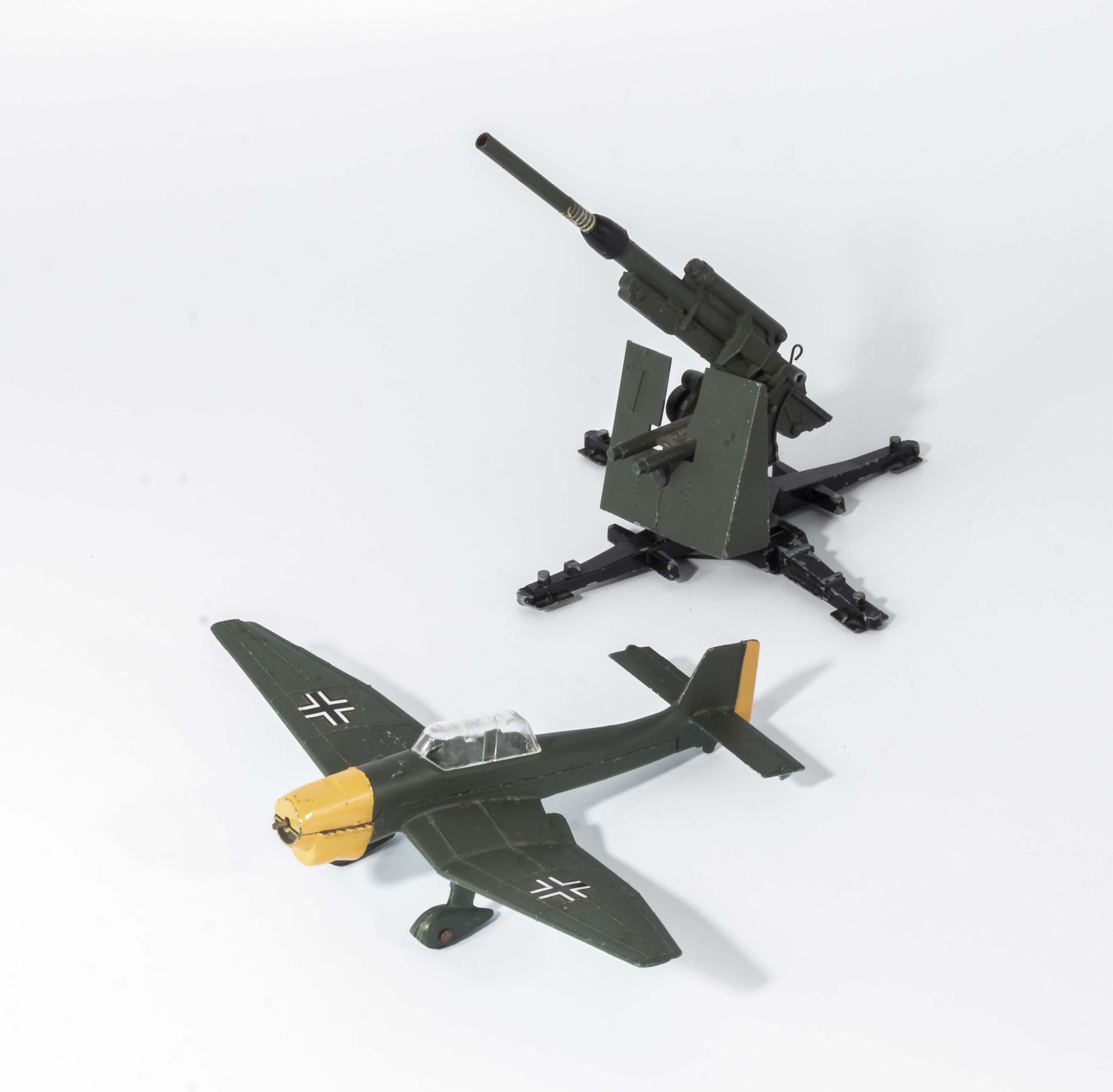 A Dinky die cast 88mm gun together with a Dinky Junkers Ju 87B